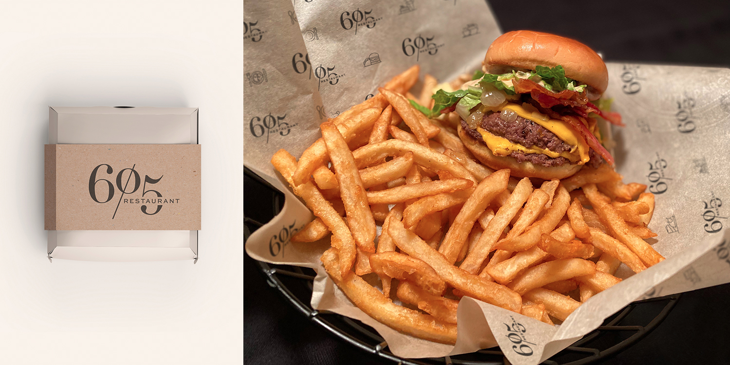 Left: burger box featuring Restaurant 605 logo; Right: Burger and fries on Restaurant 605 patterned parchment paper